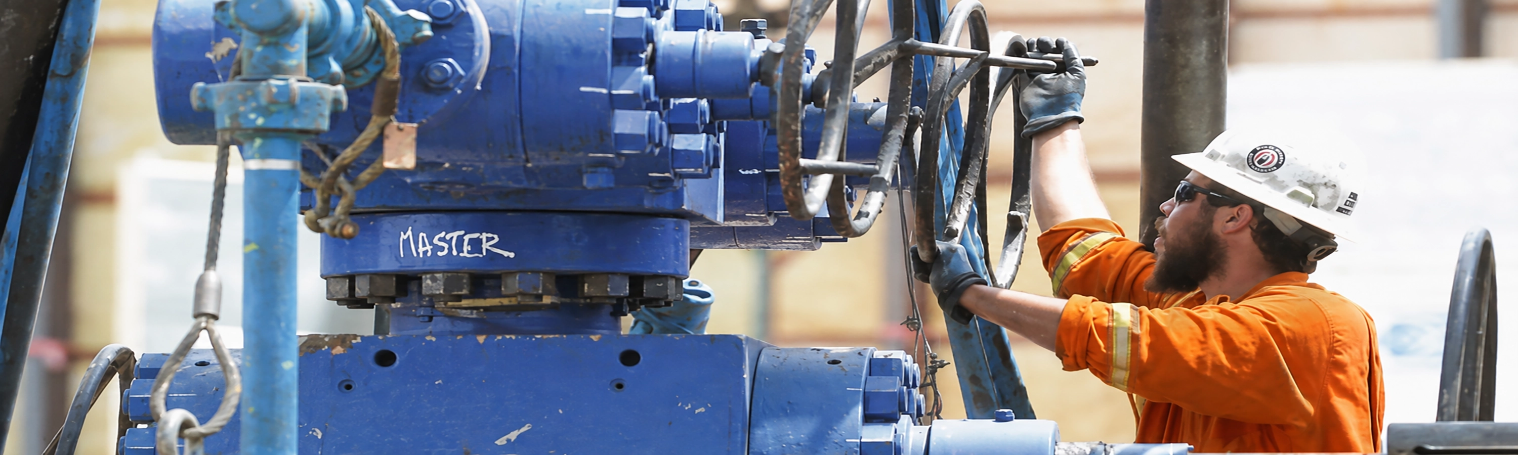 Oilfield technician operating production for Schooner Energy oil and natural gas operations