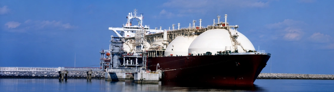 LNG carrier at a marine terminal representing Schooner Energy’s connection to natural gas markets and regional energy security.