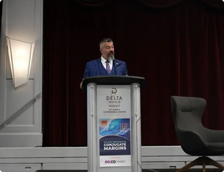 Newfoundland and Labrador Minister of Energy and Mines Lloyd Parrott speaking at the 2026 EAGE Conjugate Margins Conference.